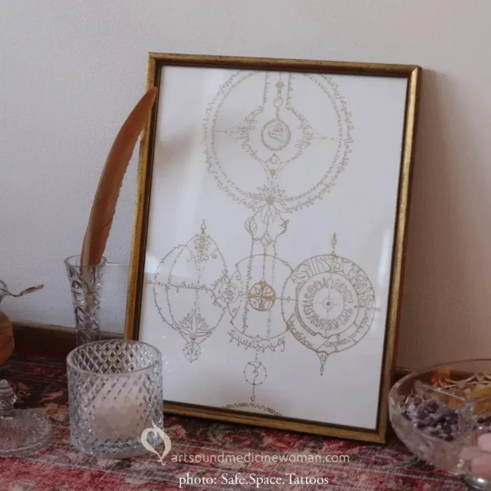 Soul Drawing framed in a golden frame, leaning against the wall, surrounded by sacred objects in crystal jars, vases and bowls.