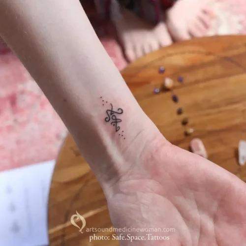 Soul Tattoo on the inside of my right wrist. The tattoo is composed of two symbols that were joined along with dots put in a particular way above and underneath. Soul Tattoos are available in my Art Shop.